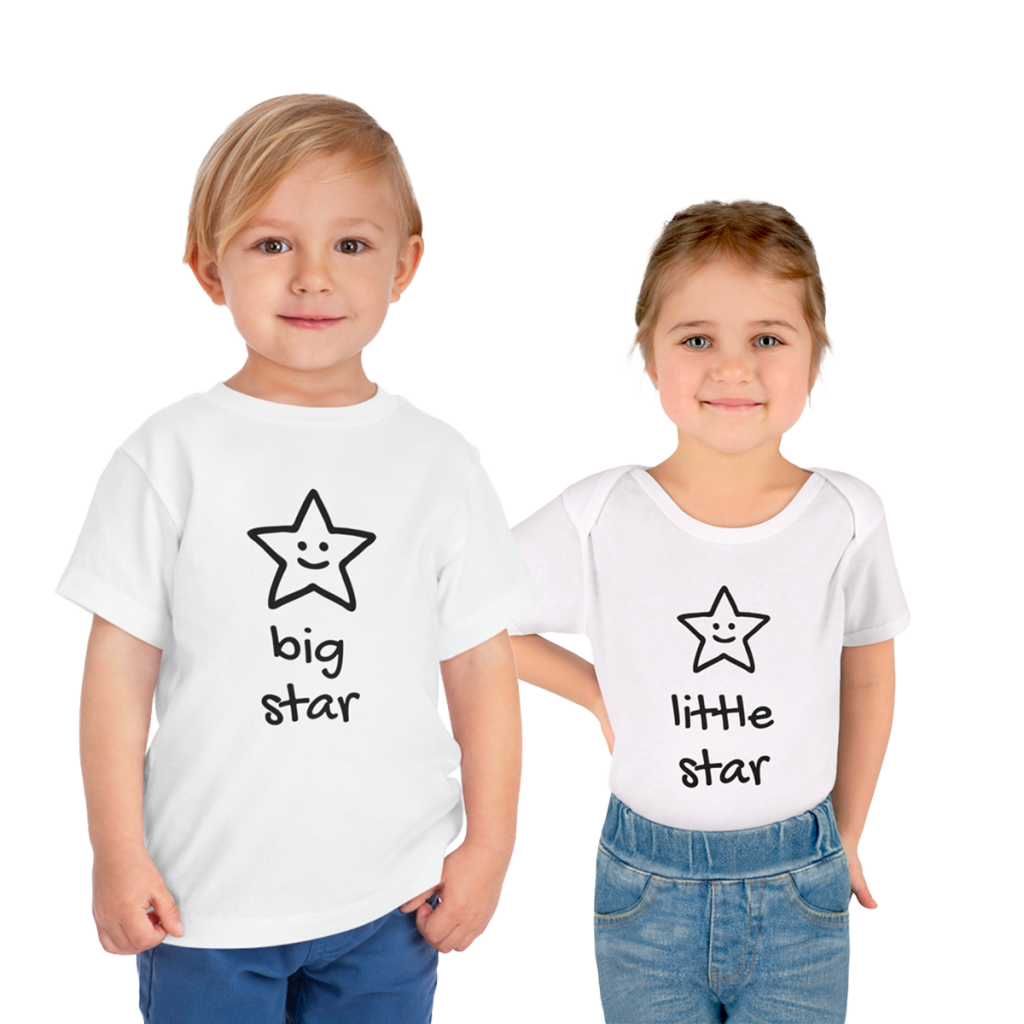 Smiling toddler in a Little Star bodysuit, with older sibling in Big Star toddler tee showcasing Little Bunny Clothing's newest addition.